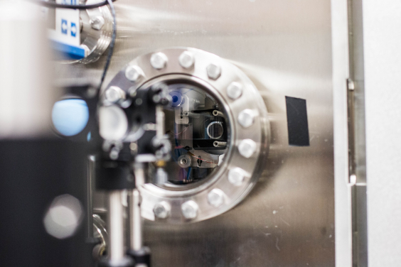 The team used highly sensitive optics to monitor the temperature of the silicon nitride membranes during the experiment. (UC Berkeley photo by Violet Carter)